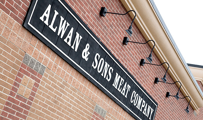 Outdoor signage at Alwan and Sons location